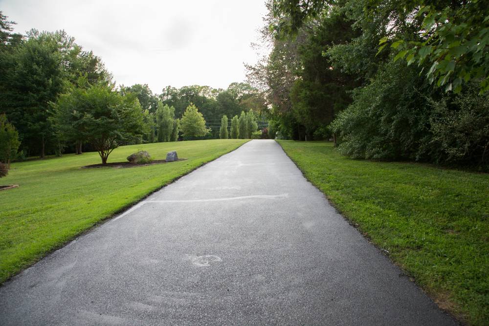 Read more about the article Spring Driveway Repaving in North Carolina: When Winter Damage Means It’s Time to Replace